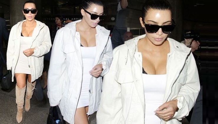 Kim Kardashian slips into her Tightest Dress yet as she lands back in LA with Kris Jenner