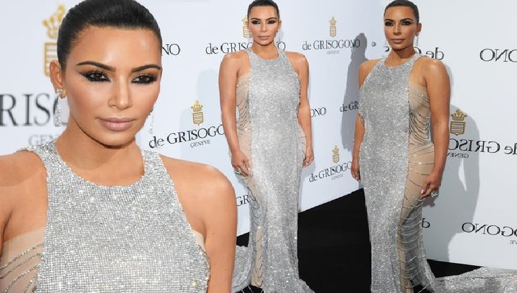 Kim Kardashian cuts glamorous figure in sheer-panelled silver dress at Cannes – but opts for VERY dramatic make-up