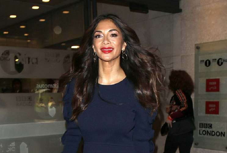 Nicole Scherzinger flashes a beaming smile as she flaunts her toned legs in thigh-grazing navy dress for One Show appearance