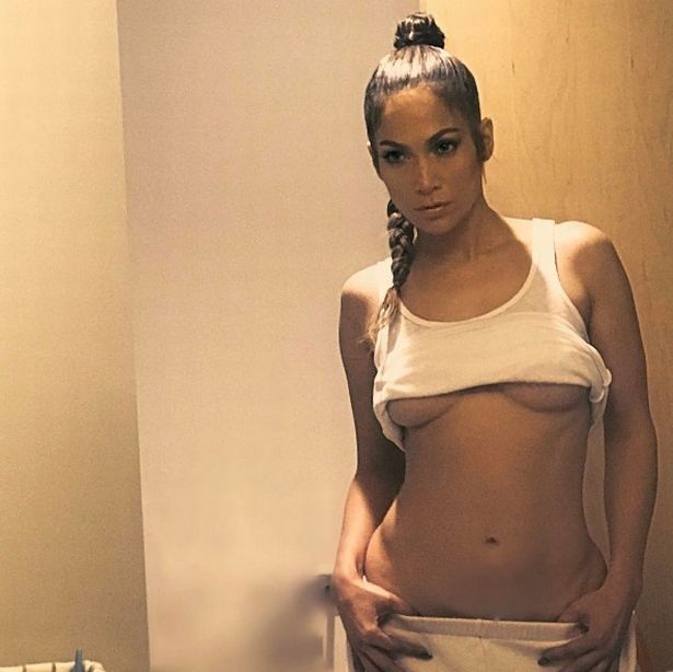 Jennifer Lopez shows Drake what he’s missing as she flashes underboob and toned tummy in sizzling shot