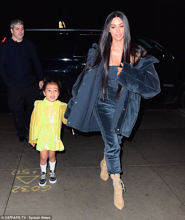 Kim Kardashian is striking in blue while North West, 3, stands out in neon as they take in Swan Lake in NYC