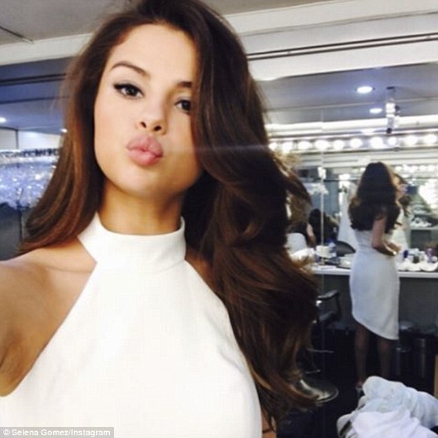 Selena Gomez puckers up for selfie in White Halter Dress… after hot date with The Weeknd