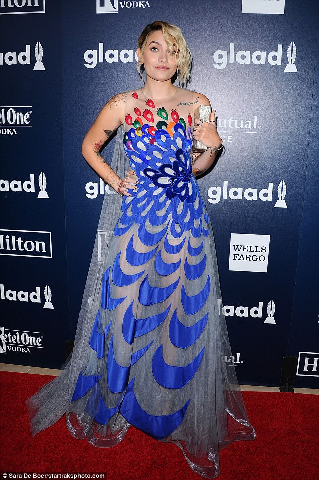 Pretty as a peacock! Paris Jackson dazzles GLAAD Media Awards in gossamer caped gown