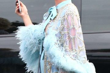 Katy Perry oozes old Hollywood glamour in a feather wrap and blonde wig as she arrives on American Idol set