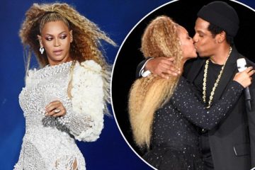 Beyonce and Jay Z share a kiss on stage after their New Jersey concert was delayed