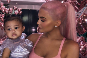 Kylie Jenner poses with a dolled-up Baby Stormi at Kylie X Jordyn Collection launch Party
