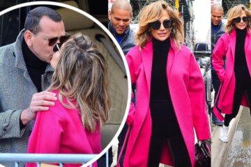 Jennifer Lopez in a hot pink coat as kiss with new fiance Alex Rodriguez in NYC